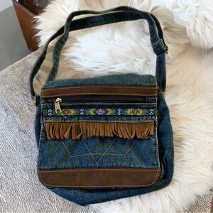 VTG Denim Jean cross body bag with leather fringe trim and colorful beaded trim.